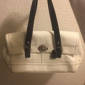 White and black coach purse